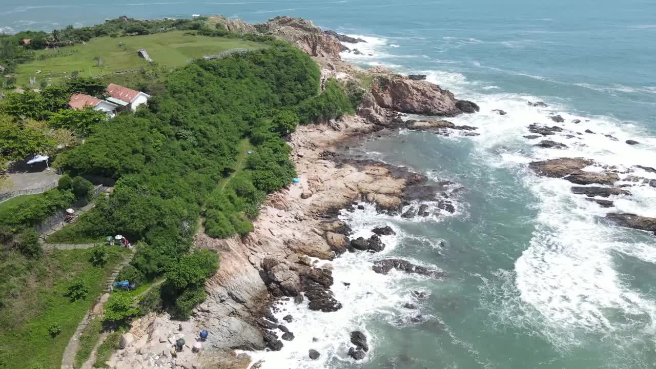 Licensed stock view of waves meeting rocky coastal cliffs